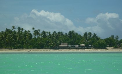 Looking from the lagoon across at homes on Abaiang Island, a low-lying coral atoll in Kiribati. (Credit: Karen McNamara)